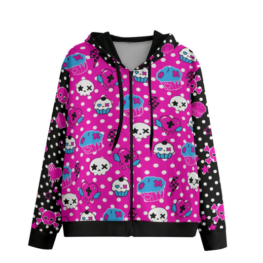 Front view of a pink polka dot zip hoodie featuring skulls, zombie cupcakes, winged hearts, lightning bolts, and scene girl graphics on a black and hot pink background.